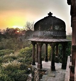 Built structure against sky at sunset