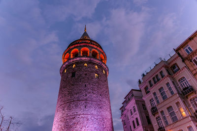 Low angle view of illuminated building against sky