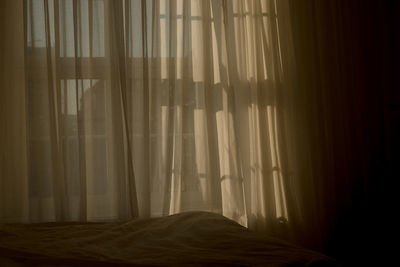 Curtain hanging from window at home