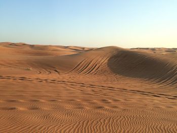 Scenic view of desert against clear sky