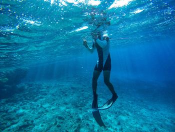 Man swimming in sea