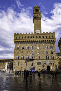 Palazzo vecchio and its medieval tower and clock - florence, tuscany, italy