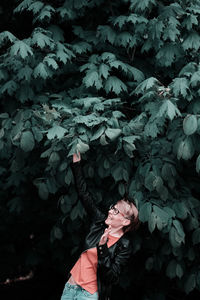 Midsection of woman with flowers on leaves