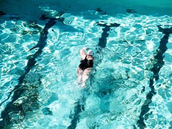 High angle view of man swimming in pool