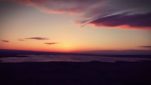 Scenic view of sea against romantic sky