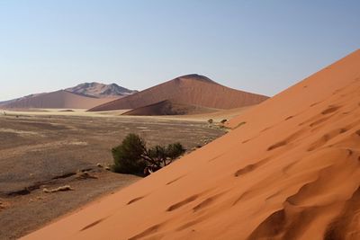 Scenic view of desert against clear sky