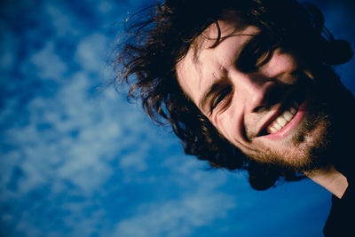 Portrait of mid adult man against sky