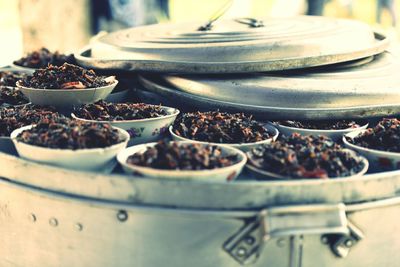 Close-up of food in bowls in metallic container