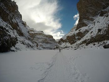 Scenic view of snowcapped mountains against sky