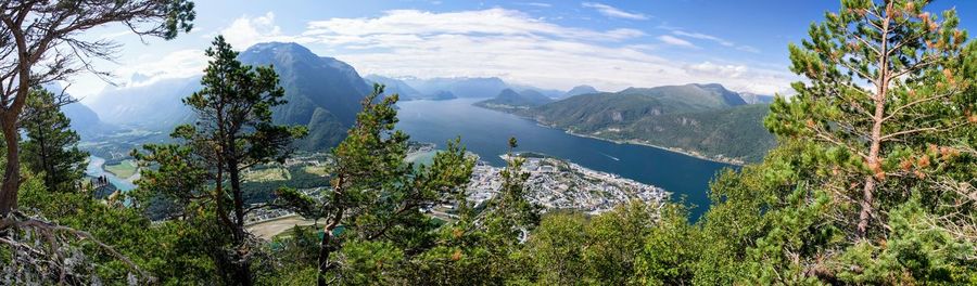 Panoramic view of trees and mountains against sky