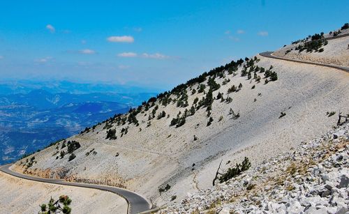 Low angle view of mountains against blue sky