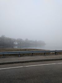 Road against sky during foggy weather