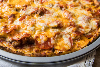 Close-up of pizza served on table