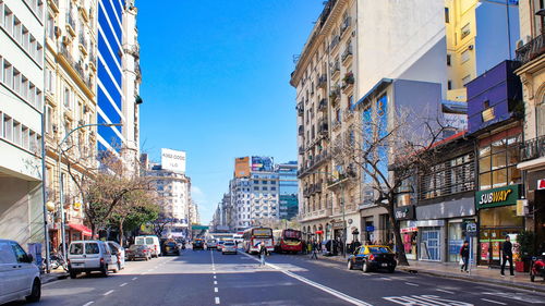 City street and buildings against sky