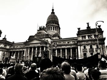 Tourists in front of historical building