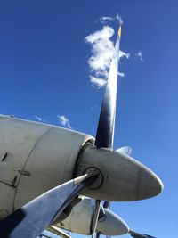 Low angle view of airplane against sky