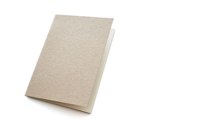 Close-up of open book against white background