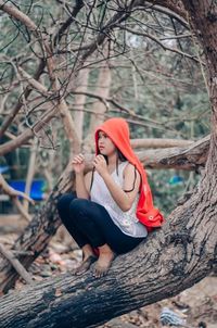 Portrait of young woman sitting outdoors