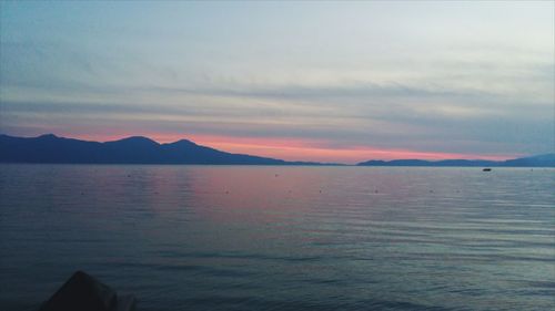 Scenic view of mountains against sky at sunset