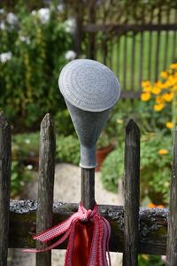 Close-up of wooden post in cemetery