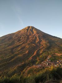 Scenic view of mountain against clear sky in the sunrise