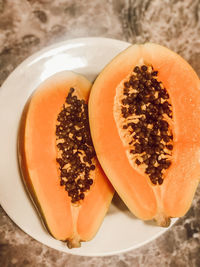 High angle view of breakfast on table, papaya