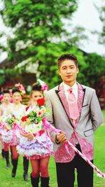 Full length of smiling boy in park