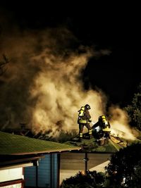 Firefighters at work against smoke