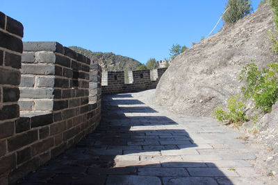 Footpath leading towards wall