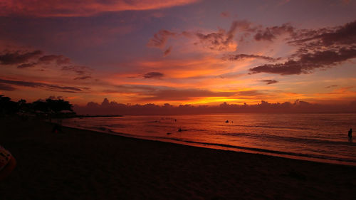 Scenic view of beach against sky during sunset