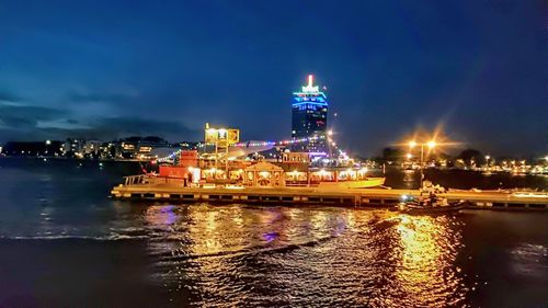 Illuminated buildings in city at night