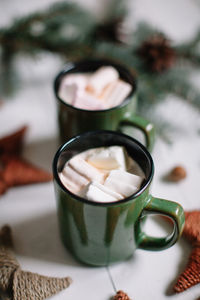 Close-up of hot chocolate in mugs on table