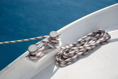 High angle view of rope tied yacht cleat