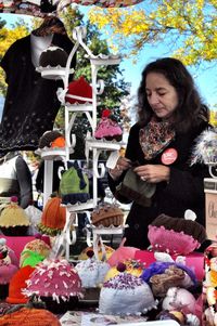 Full length of woman with toy standing in park during winter