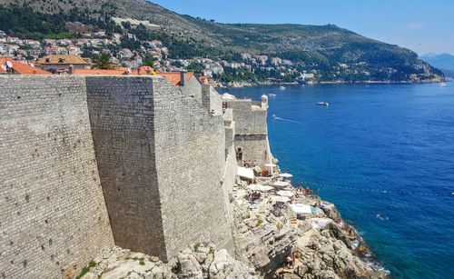 High angle view of town by sea