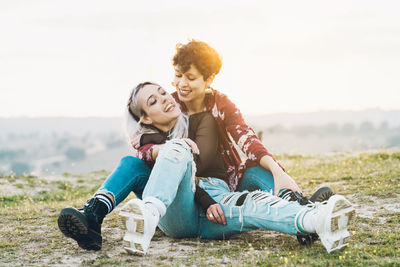 Young couple sitting outdoors