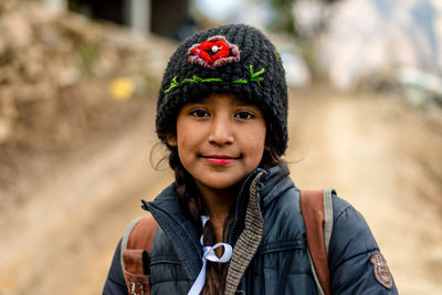 Portrait of smiling woman wearing hat