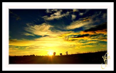 Scenic view of landscape against cloudy sky