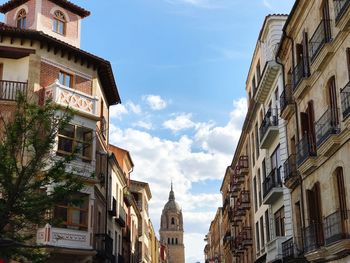 Low angle view of buildings in city against sky