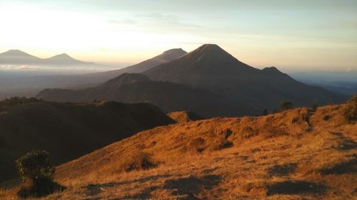 Scenic view of mountains against sky during sunset