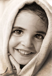 Close-up portrait of smiling young woman