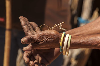 Close-up of man holding hands