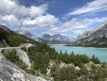 Scenic view of lake and mountains against sky