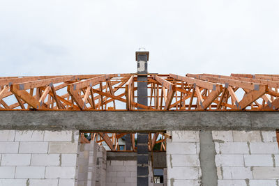 Low angle view of construction site against sky