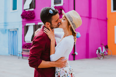 Side view of couple kissing