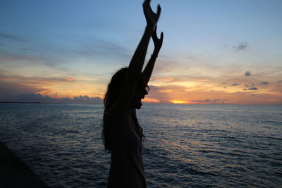 Scenic view of sea at sunset