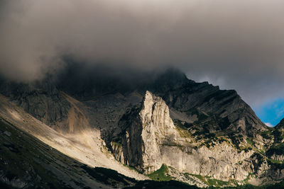 Scenic view of mountain against cloudy sky