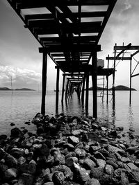 Pier over sea against sky