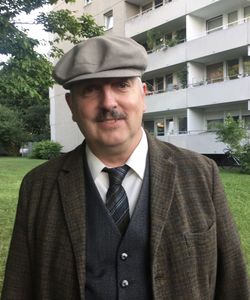 Portrait of smiling man standing outdoors