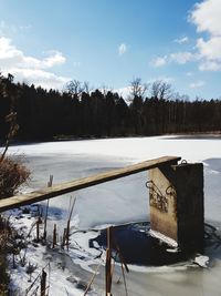 Scenic view of frozen lake against sky during winter